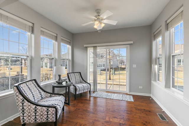 sunroom featuring ceiling fan