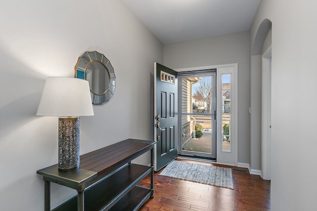 foyer with dark hardwood / wood-style floors