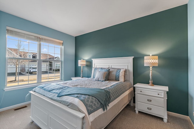 bedroom with light carpet