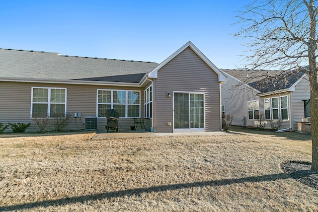 back of house featuring a yard and a patio area