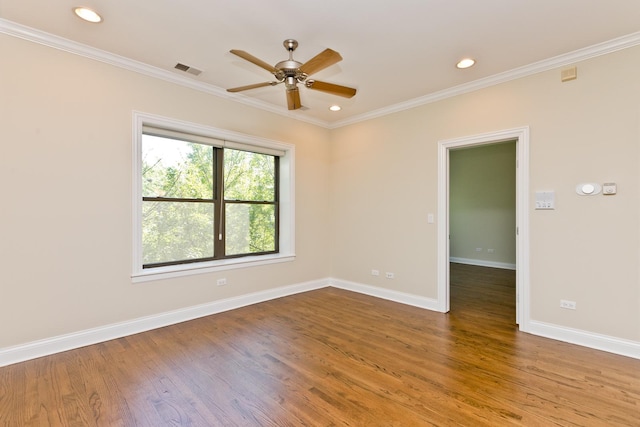 unfurnished room with hardwood / wood-style flooring, crown molding, and ceiling fan