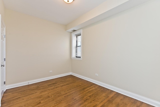 unfurnished room featuring hardwood / wood-style flooring