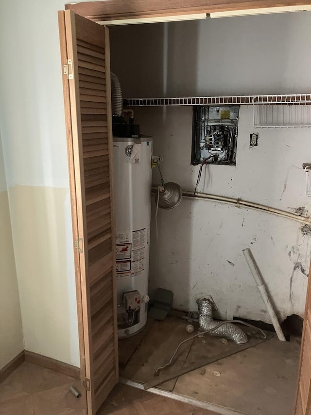 utility room featuring gas water heater