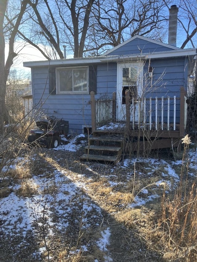 view of front of property with a wooden deck