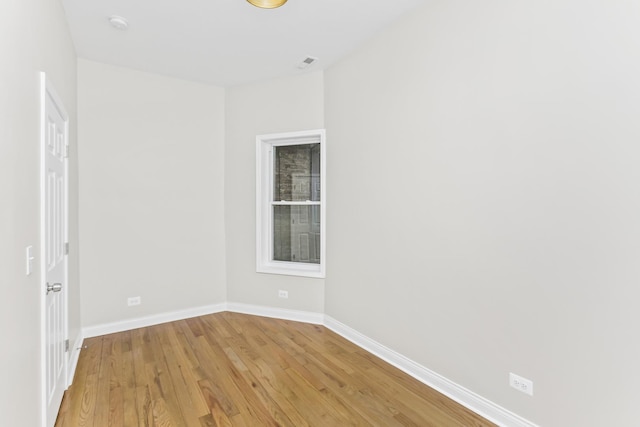 unfurnished room featuring light hardwood / wood-style floors