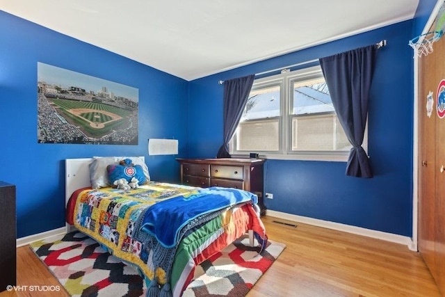 bedroom with hardwood / wood-style flooring