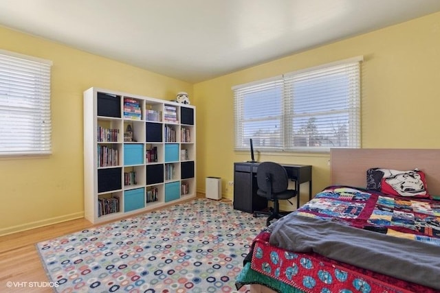 bedroom with hardwood / wood-style floors