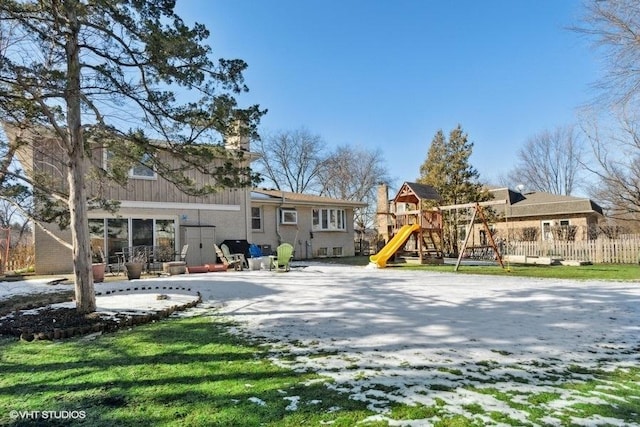 rear view of house with a playground