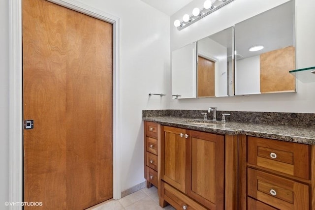 bathroom with vanity and tile patterned flooring