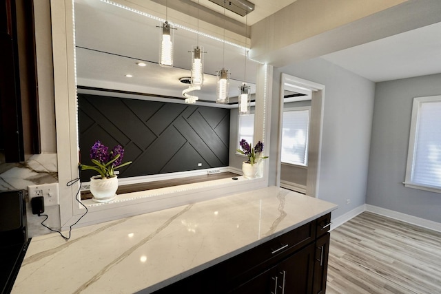 bathroom featuring tasteful backsplash and hardwood / wood-style floors