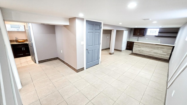 kitchen featuring dark brown cabinetry