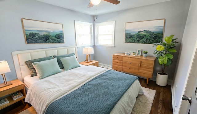 bedroom with ceiling fan and dark hardwood / wood-style flooring