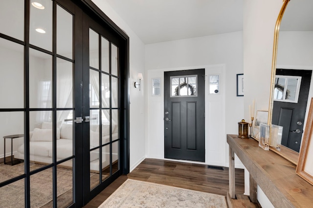 foyer entrance featuring dark wood-type flooring and french doors