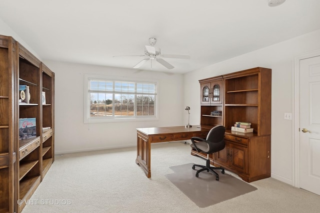 home office with ceiling fan and light colored carpet