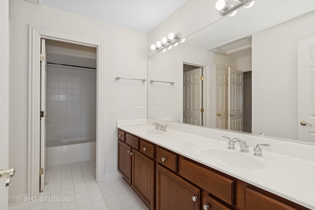 bathroom featuring vanity, tile patterned floors, and tiled shower / bath