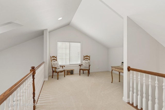 sitting room featuring lofted ceiling and light colored carpet