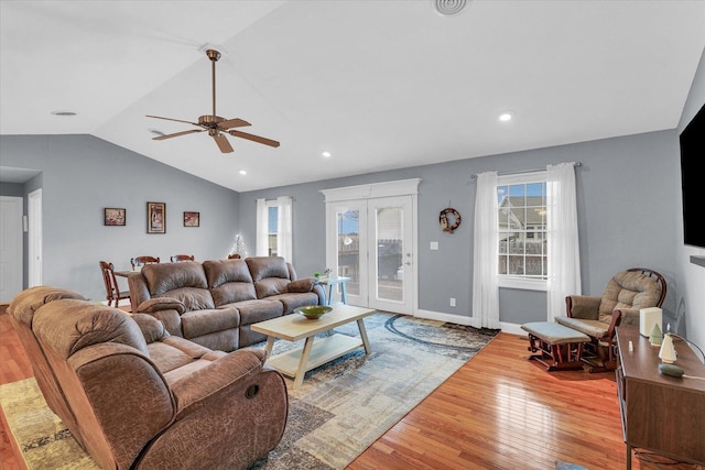 living area with a ceiling fan, baseboards, lofted ceiling, recessed lighting, and hardwood / wood-style flooring