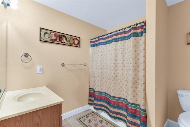 full bath with vanity, a shower with curtain, baseboards, tile patterned floors, and toilet