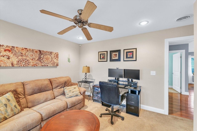 office space featuring visible vents, light carpet, recessed lighting, baseboards, and ceiling fan