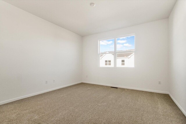 bedroom with connected bathroom, a notable chandelier, and light colored carpet