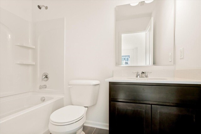 bathroom with vanity, an enclosed shower, and toilet