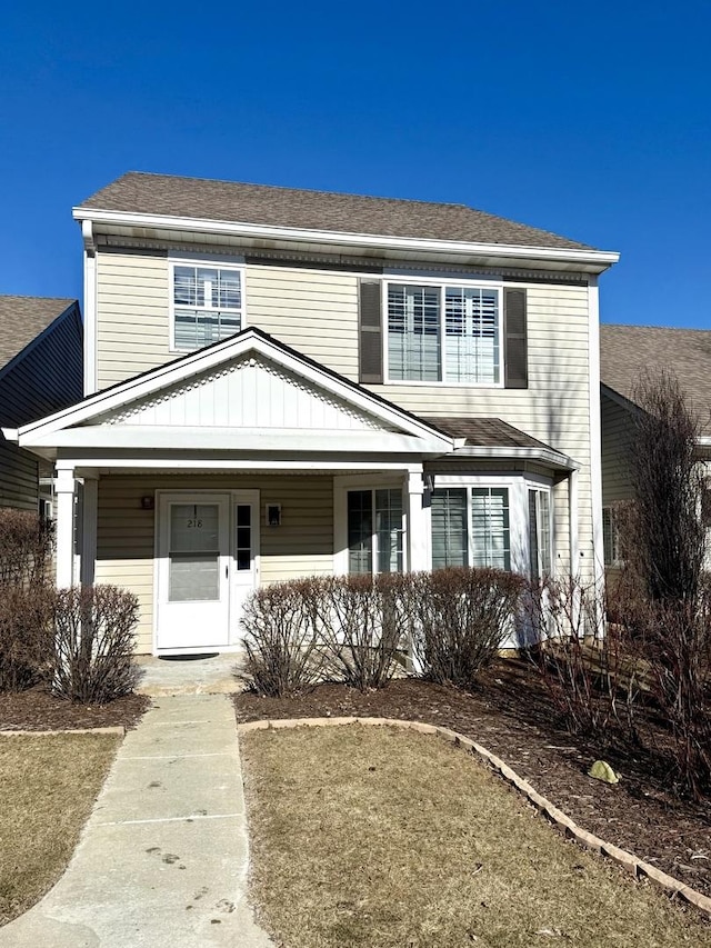 view of front of house featuring a front yard and a porch