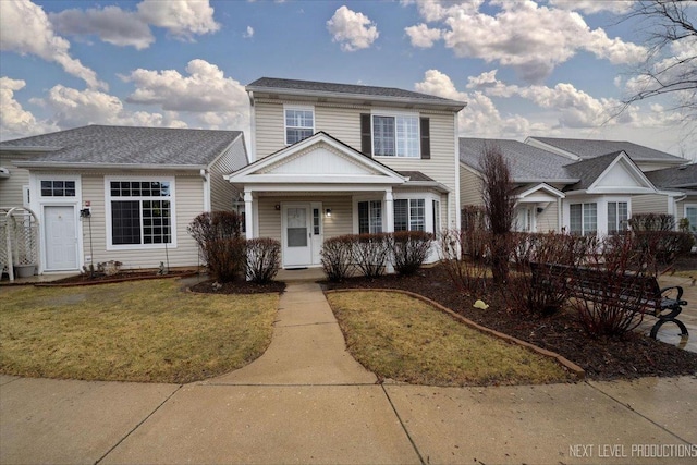 view of front of property with a front lawn and a porch