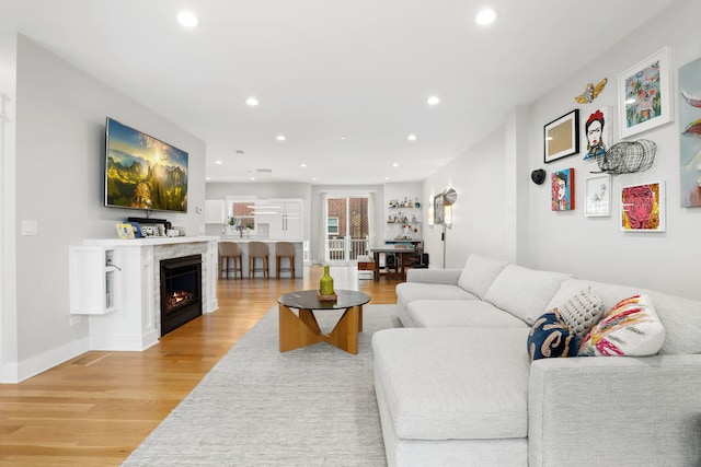 living room with light hardwood / wood-style flooring