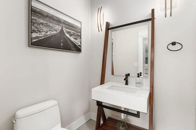 bathroom with sink and toilet