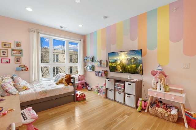 bedroom featuring hardwood / wood-style flooring