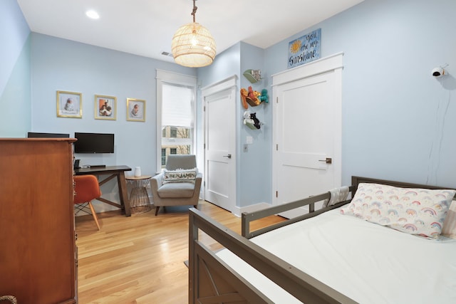 bedroom with light wood-type flooring