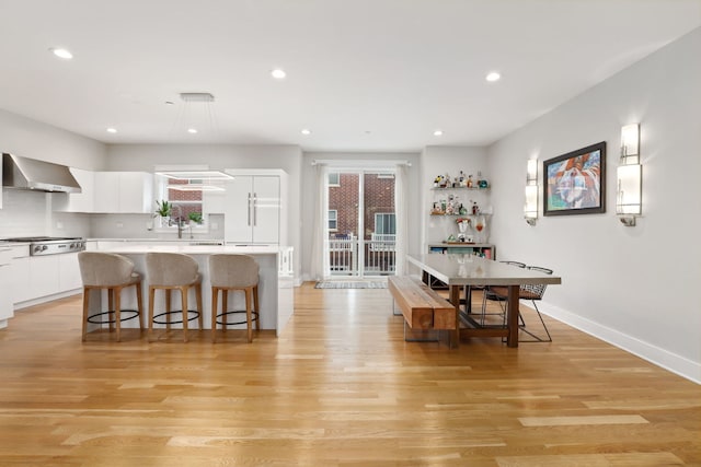 dining area with light hardwood / wood-style flooring