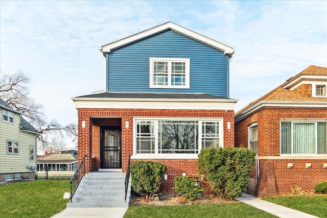 view of front of home featuring a front lawn