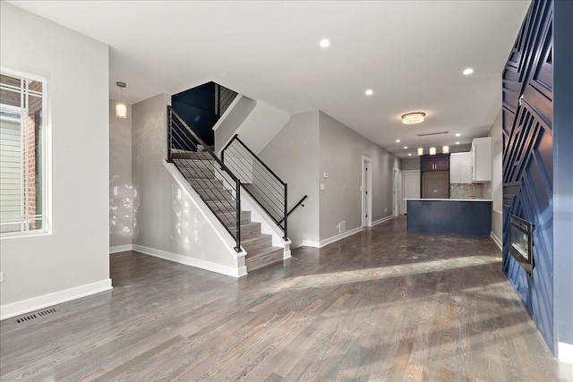 interior space with dark hardwood / wood-style floors