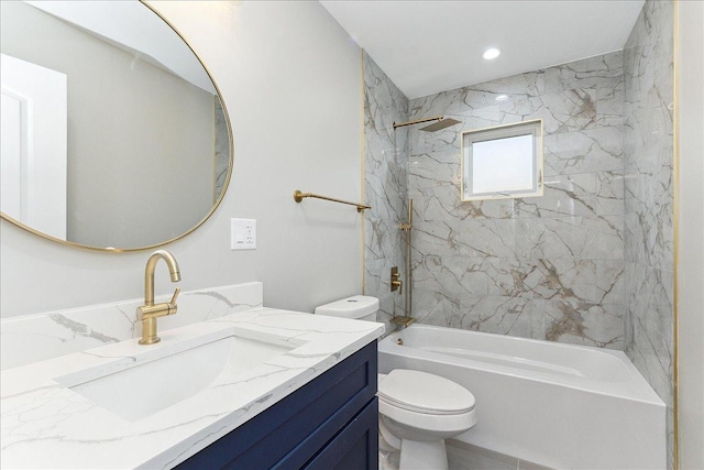 full bathroom featuring vanity, toilet, and tiled shower / bath combo