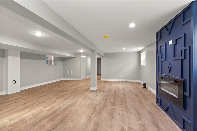 basement with light wood-type flooring