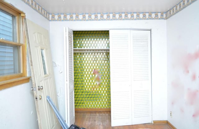 entryway with hardwood / wood-style floors