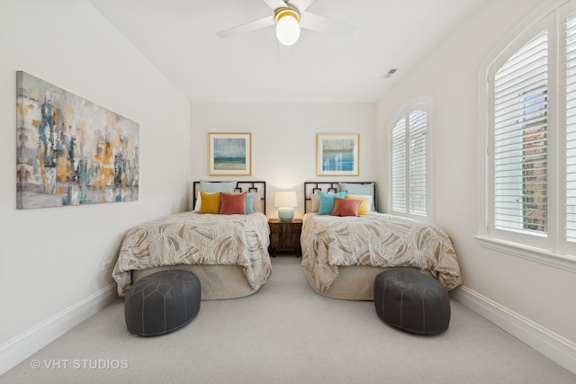 bedroom featuring carpet, visible vents, ceiling fan, and baseboards