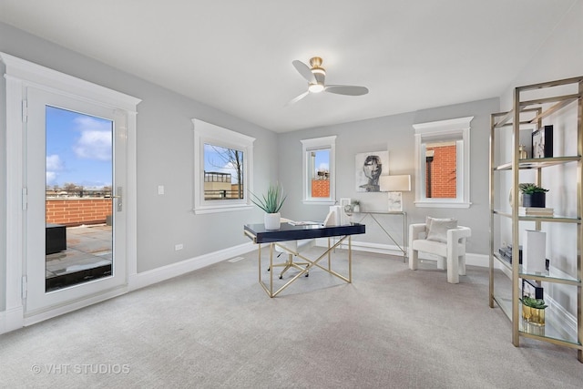 home office with ceiling fan, carpet floors, and baseboards