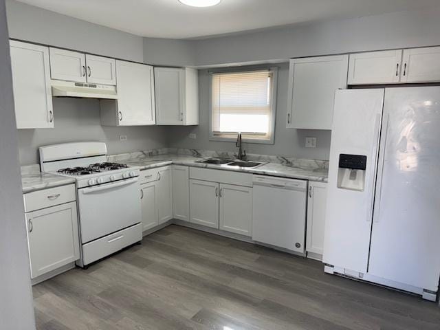 kitchen featuring white cabinetry, dark hardwood / wood-style flooring, sink, and white appliances