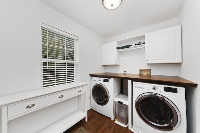 laundry room featuring cabinets, dark hardwood / wood-style floors, and washing machine and clothes dryer