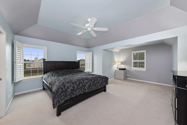 carpeted bedroom featuring lofted ceiling and ceiling fan