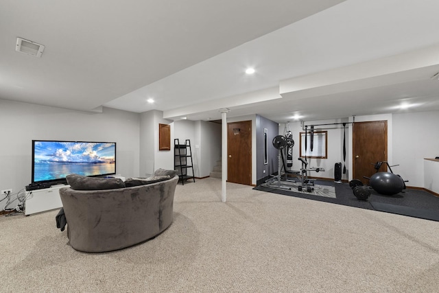 workout area featuring light carpet