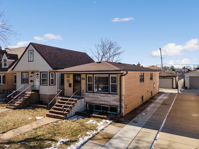 view of front of home with an outbuilding and a garage