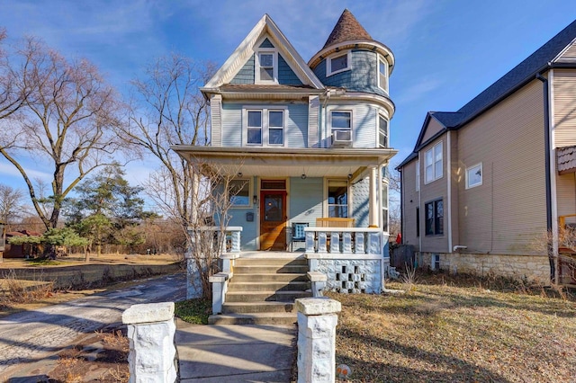 victorian-style house featuring covered porch