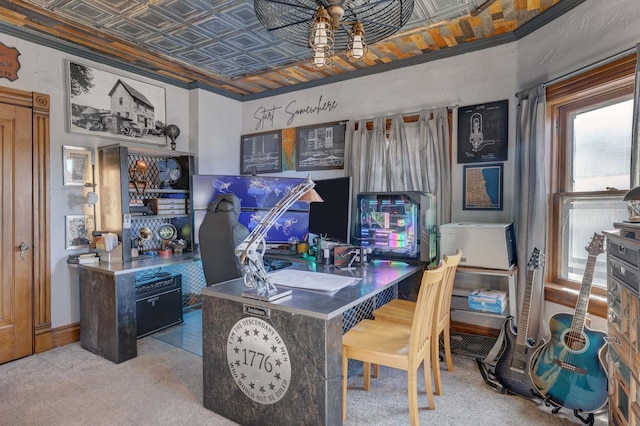 carpeted home office featuring ornamental molding and ceiling fan