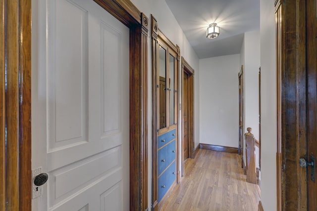 hallway featuring light hardwood / wood-style flooring