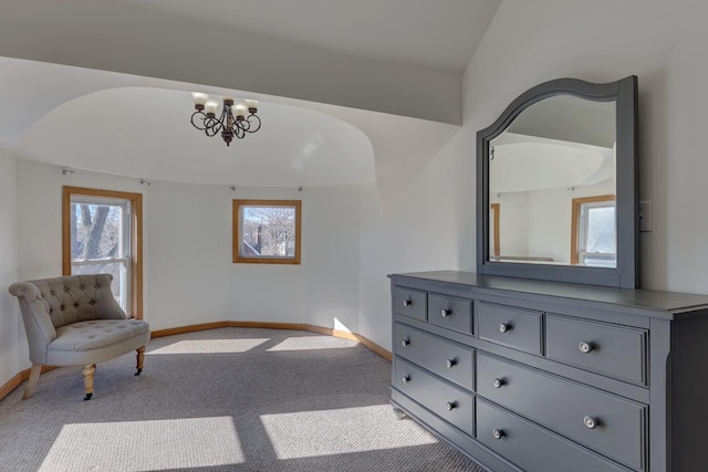 sitting room with light colored carpet and a chandelier