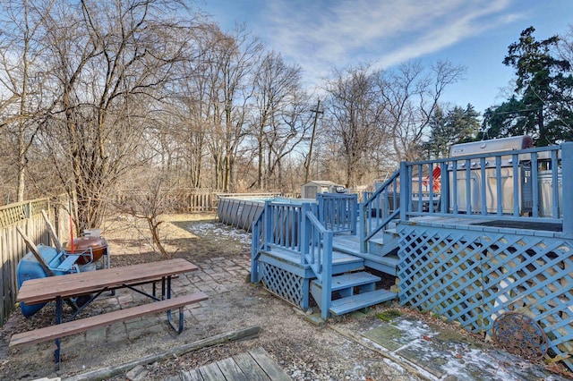 wooden deck featuring a pool