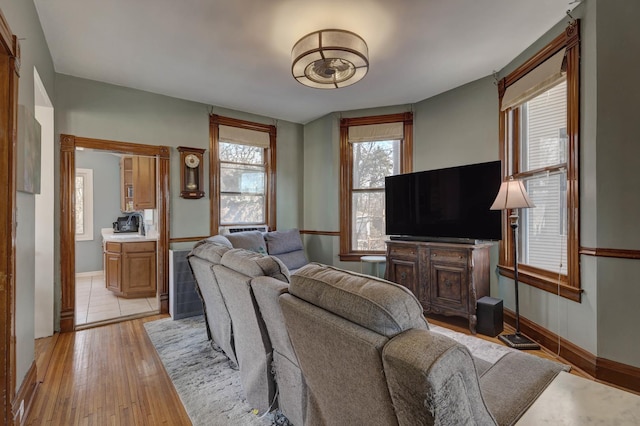 living room with light hardwood / wood-style flooring